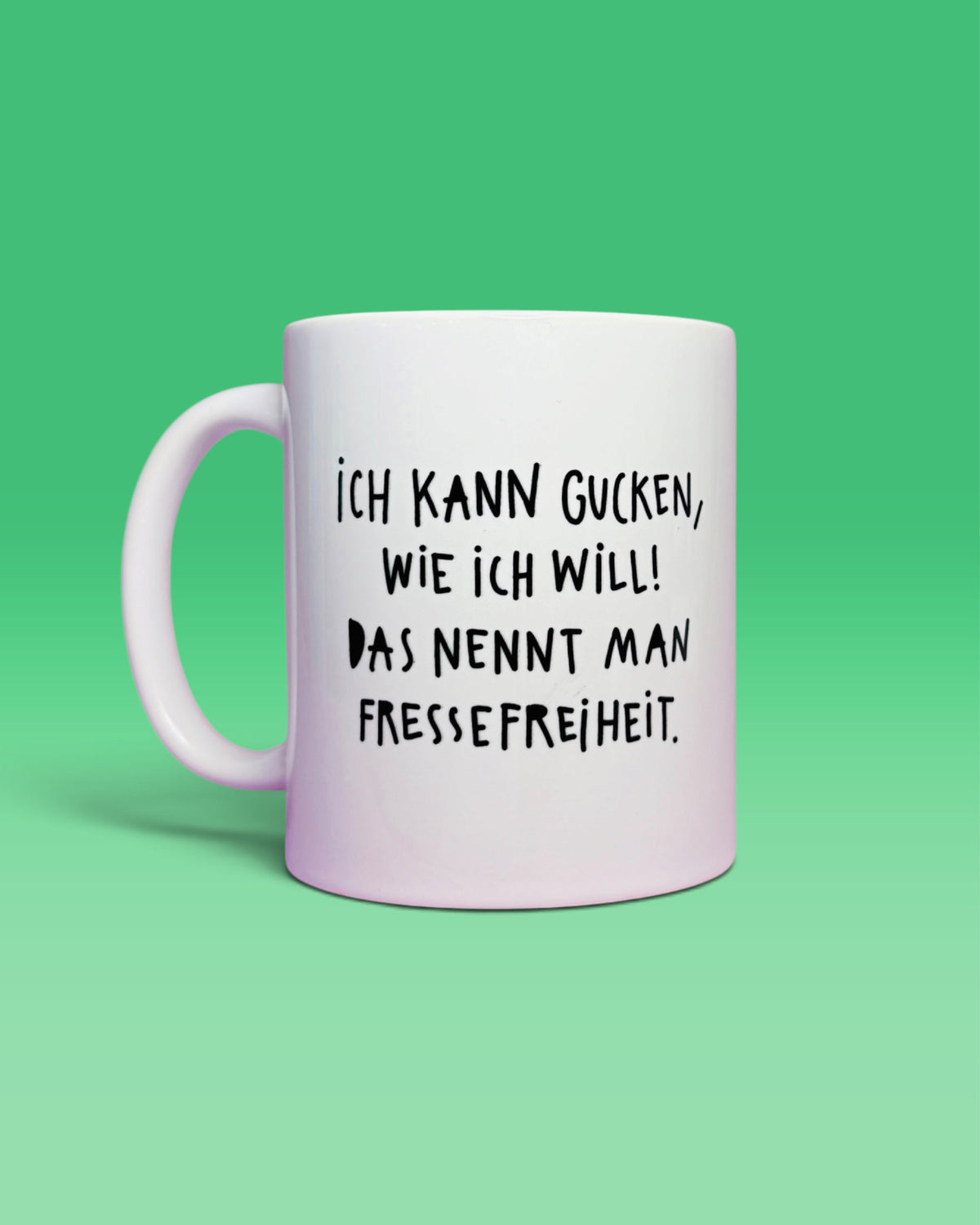 Rückseite der Tasse mit dem Schriftzug „Ich kann gucken, wie ich will! Das nennt man Fressefreiheit.“
