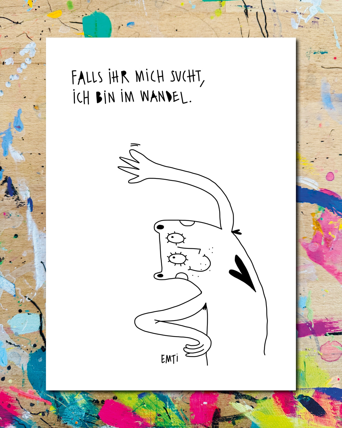 Postkarte: eine Figur mit Herz, seltsam verdreht und kopfüber, dazu der Schriftzug „Falls ihr mich sucht, ich bin im Wandel.“