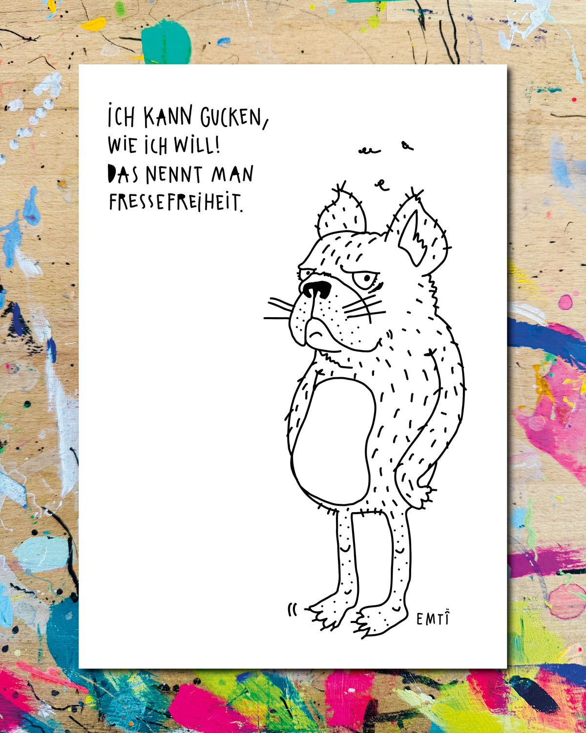 Postkarte: ein grimmig guckender Hund, dazu der Schriftzug „Ich kann gucken, wie ich will! Das nennt man Fressefreiheit.“
